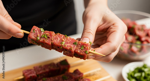 Eid al-Adha Preparations, Close-up of hands carefully threading marinated beef cubes onto bamboo skewers, glistening meat texture with herbs