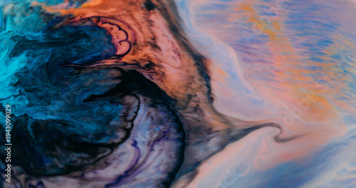 Ink explosion blur. Pigment droplet. Blue black orange liquid spill on colorful background. Bright fluid splash abstract art splatter.