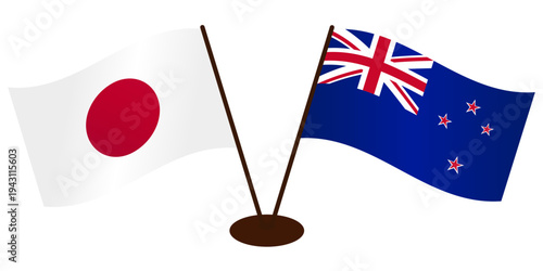 Developing flags of Japan and New Zealand standing on the same stand