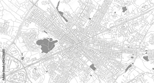 Detailed aerial view of a city with parks and buildings.