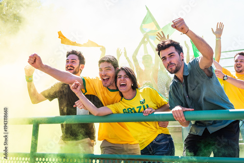 Brazilian football fans cheering with smoke flare
