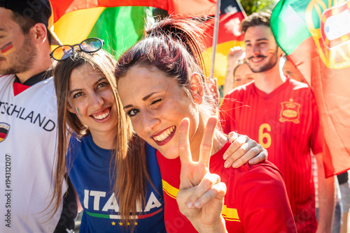 Football fans celebrating unity waving flags