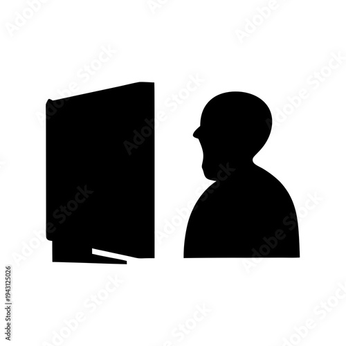 Silhouette of a person intensely focused on a computer screen in black