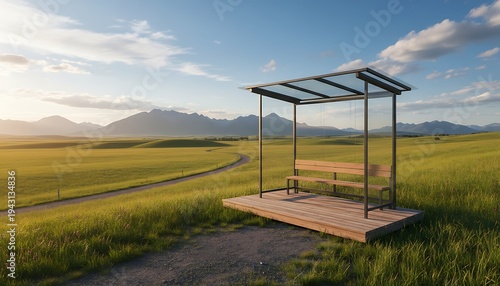 Sunny Open Field Bus Stop on Green Grass with Mountain Backdrop