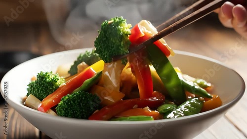 Steaming bowl of freshly cooked vegetables with natural lighting and close up shot