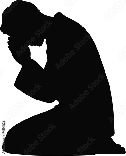 Silhouette of a person kneeling with head bowed in prayer or supplication Keywords: silhouette, person, man, kneeling, praying