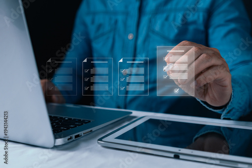 Businessman using stylus on virtual digital documents. Concept of paperless office, electronic signature, smart contract, and online approval to guarantee compliance and business quality.
