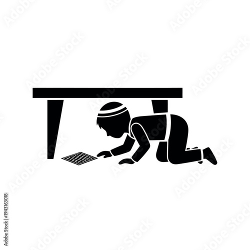 Child crawling under table looking at something on floor.