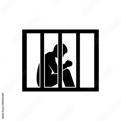 Silhouette of a person in jail behind bars.
