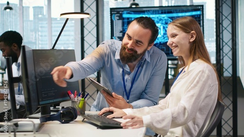 Mentor teaching young employee to troubleshoot software errors using AI. Manager doing induction to newcomer junior dev using computer to write code, developing machine learning APIs, camera A