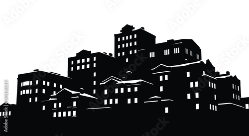 A stark cityscape of buildings against a bright background silhouette