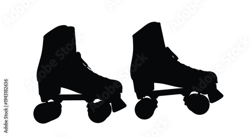 Pair of black roller skates shown in a dramatic silhouette