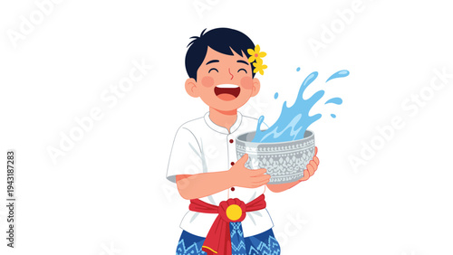 Happy Thai boy in traditional attire holding a decorative silver bowl filled with splashing water, celebrating the Songkran festival.