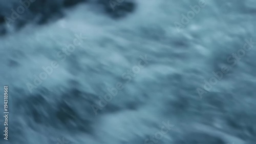 Abstract Blue Water Flowing Motion Background.