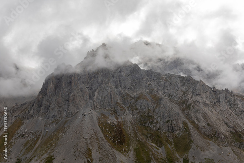 Alpine mountain landscape at Cerces massif in the French Alps, beneath an overcast sky