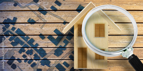 SEARCHING FOR BUILDING LOT FOR CONSTRUCTION, searching for sale, purchase, rent or investment or searching for assess to buy - Concept with magnifying glass over an home model and cadastral map