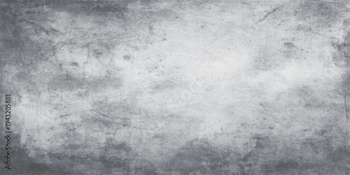 A dark aged gray concrete wall with a rough vintage metal texture creates a dirty grunge backdrop and retro stone surface design