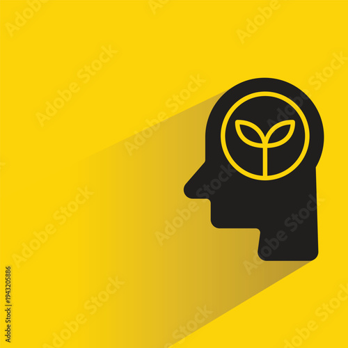 plant in human head icon with shadow on yellow background
