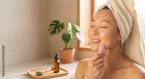 Serene young woman performing gua sha facial massage with rose quartz stone in luminous morning light for natural beauty skincare routine