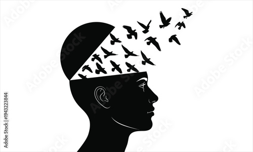 Black silhouette of a human head with birds flying out of it isolated on white background representing freedom and creativity