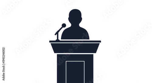Man Standing Behind Podium with Microphone.