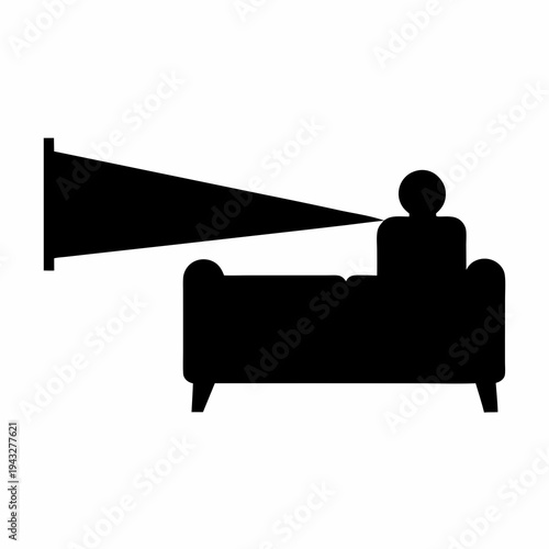 Silhouette of a Person Watching Television on a Comfortable Sofa