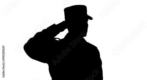 Silhouette of soldier saluting respectfully.