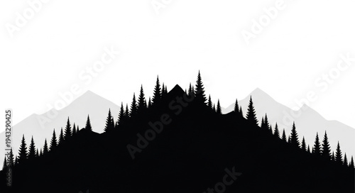 Silhouetted Forest against Mountains.