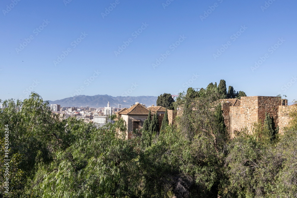 Fototapeta premium Visit to Alkazaba in Malaga, Spain with views of the city and mountains