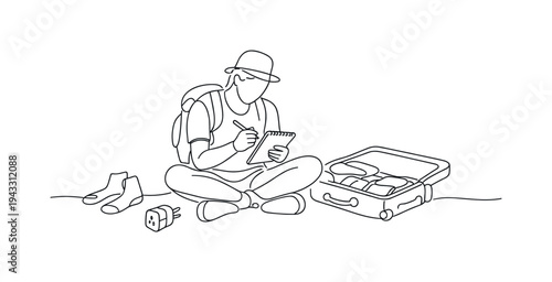 Traveler sitting cross-legged on the floor checking items off a notepad while packing, open suitcase beside them, scattered socks