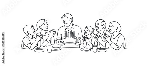 Happy family celebrating a birthday with a cake and candles, clapping hands