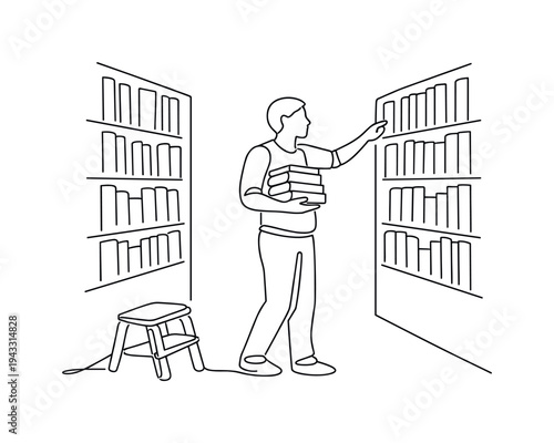 Person standing between tall library shelves scanning book spines with one hand reaching out, stack of selected books held