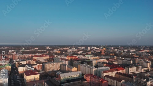 Aerial flyover rooftops towards the Turku Cathedral (Turun tuomiokirkko), Finland.