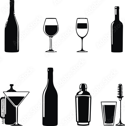 Assortment of alcoholic beverages and drinkware, including wine bottles, glasses, cocktail shaker, and martini glass