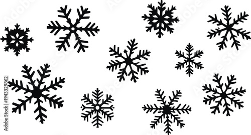 Collection of intricate snowflake designs in various sizes scattered across white background perfect for winter decoration and holiday themes seasonal winter symbols