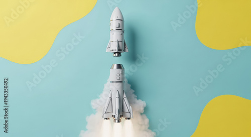 Rocket model separating during flight on colorful background  