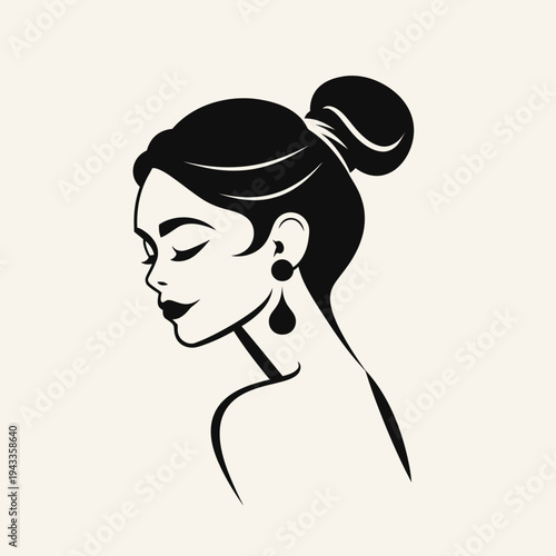 Elegant black and white portrait of a woman with updo and earrings