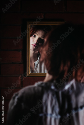 Young Woman Applying Makeup in Mirror Reflection