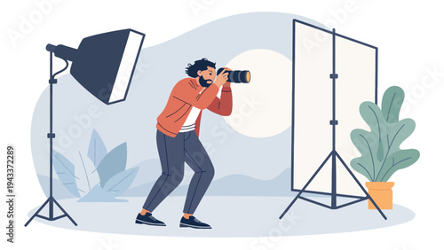 A photographer taking a picture in a studio with professional lighting equipment and a backdrop
