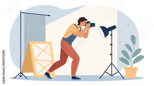 A photographer taking a picture in a studio with professional lighting equipment