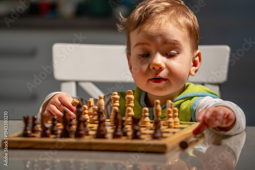 фотографія A future chess grandmaster pauses to think, learning that every move matters