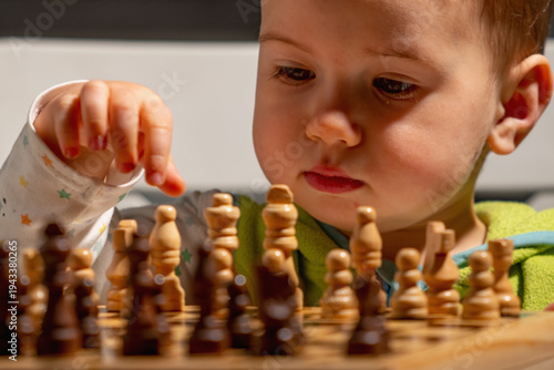 Canvas Print A future chess grandmaster begins his journey, exploring the board with curiosity and quiet determination