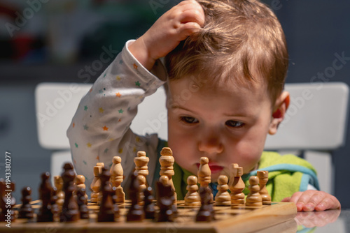 фотографія A future chess grandmaster pauses to think, learning that every move matters