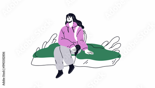 A woman sits on a green couch indoors with calm expression.