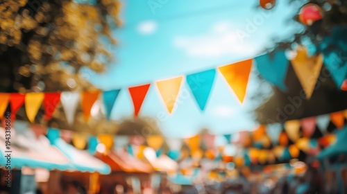 Colorful bunting flags decorating a vibrant outdoor market on a bright, sunny day, creating a festive atmosphere for a celebration.