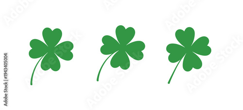 Three Green Four- Leaf Clovers with Stems on White Background shamrock four-leaf clover