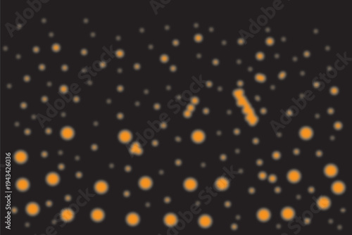 Photography Blurry image of white and orange dots on black background