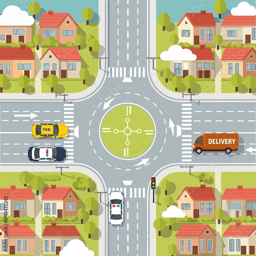Aerial view of a busy roundabout intersection with traffic, houses, and trees