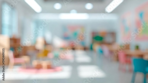 Blurred kindergarten classroom background with colorful furniture capturing themes of childhood education and learning