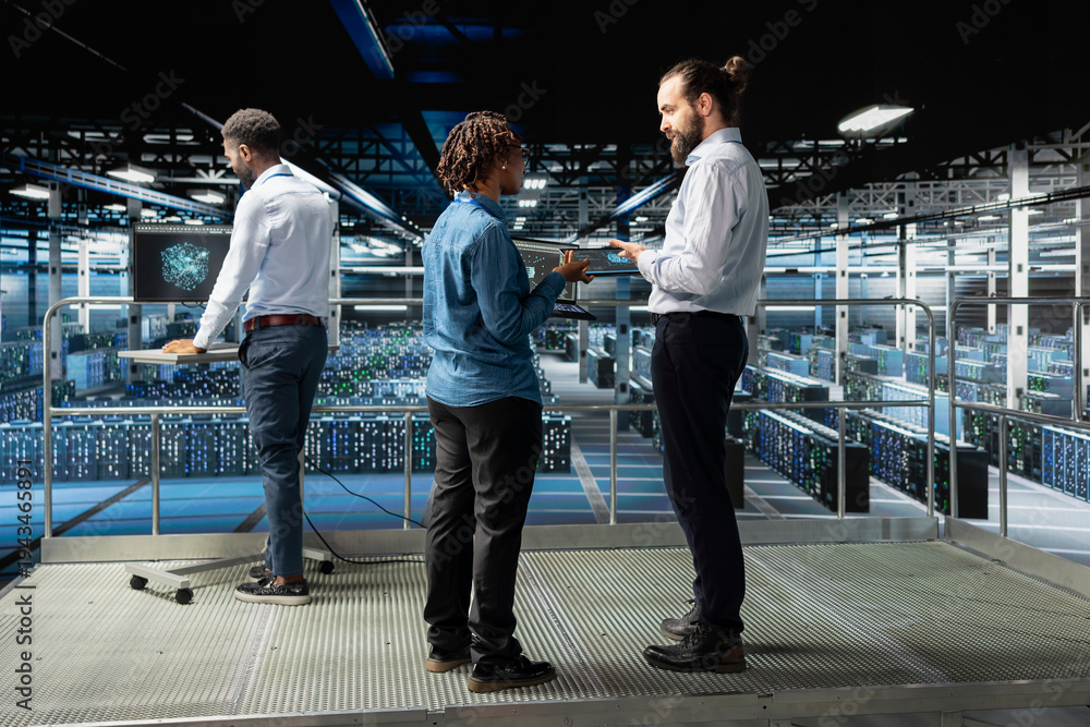 Obraz premium Data center engineers team performing maintenance on supercomputers with artificial intelligence. Server room staff members upgrading rigs used for machine learning, software engineering.